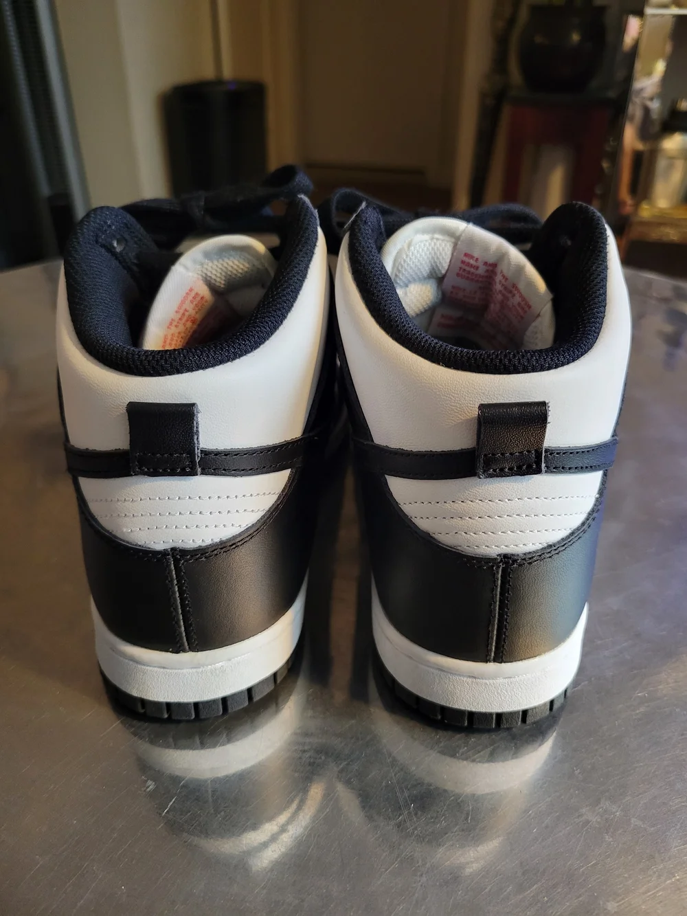 Nike Men’s Black & White Mid-Top Sneakers with Red Logo
